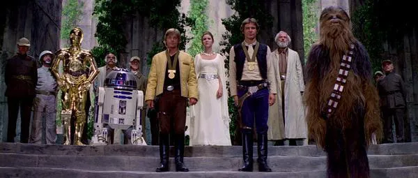 Anj Zavor, aux côtés de Bob Hudsol, pendant la cérémonie de remise de décorations aux Héros de Yavin.