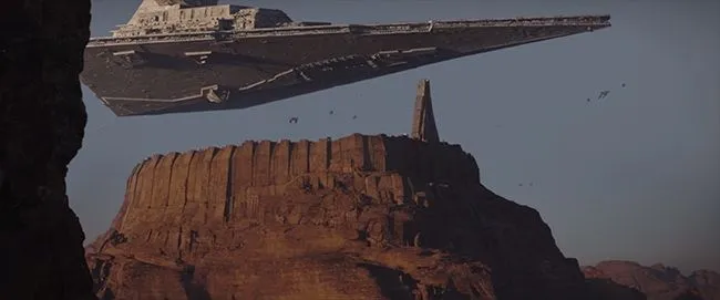 La ville sainte de Jedha City, surplombée par un Destroyer Stellaire impérial